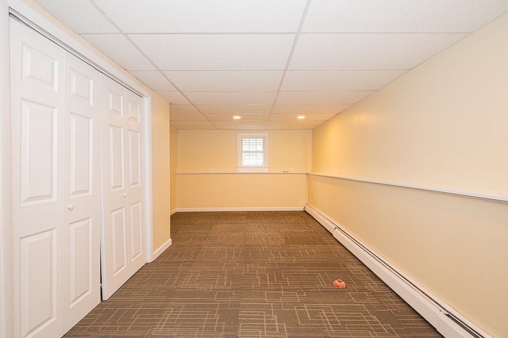 4 Kent Street Clinton, MA 01510 - Photo 30 of 39 a view of a hallway with a chandelier