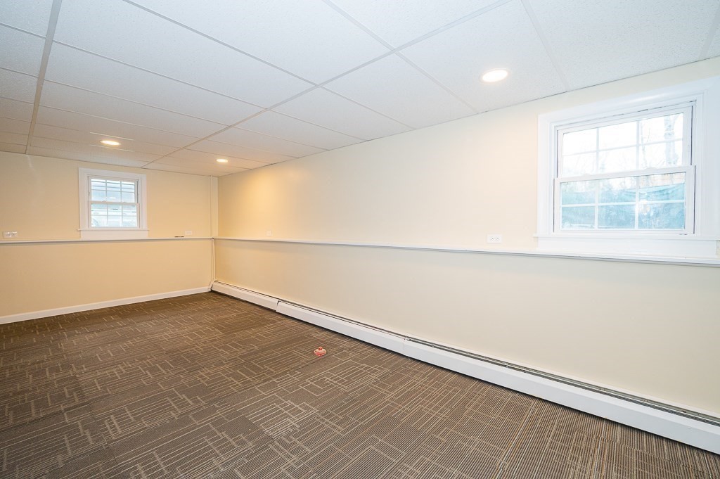 4 Kent Street Clinton, MA 01510 - Photo 32 of 39 an empty room with a empty space and window