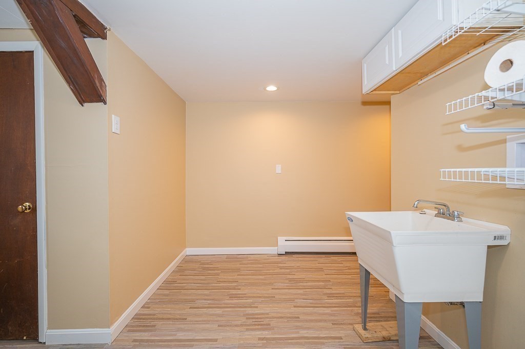 4 Kent Street Clinton, MA 01510 - Photo 33 of 39 a view of a room with wooden floor and lounge chair