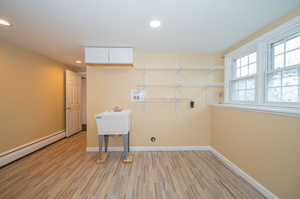 4 Kent Street Clinton, MA 01510 - Photo 34 of 39 an empty room with wooden floor and windows