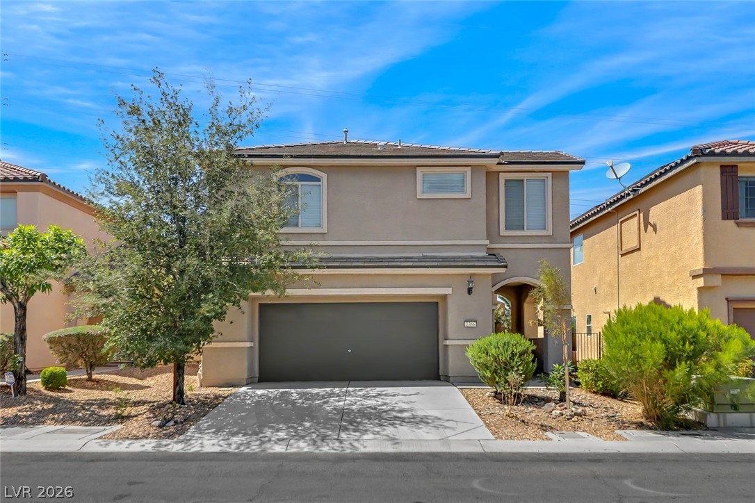 2356 Rue Bienville Way Henderson, NV 89044 - Photo 1 of 20 This two-story residence offers a garage and well-maintained landscaping, creating an inviting curb appeal.