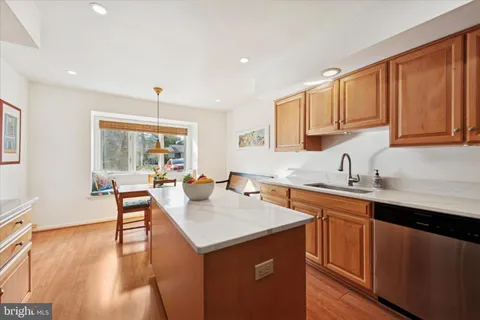 a kitchen with a sink a counter top space and appliances