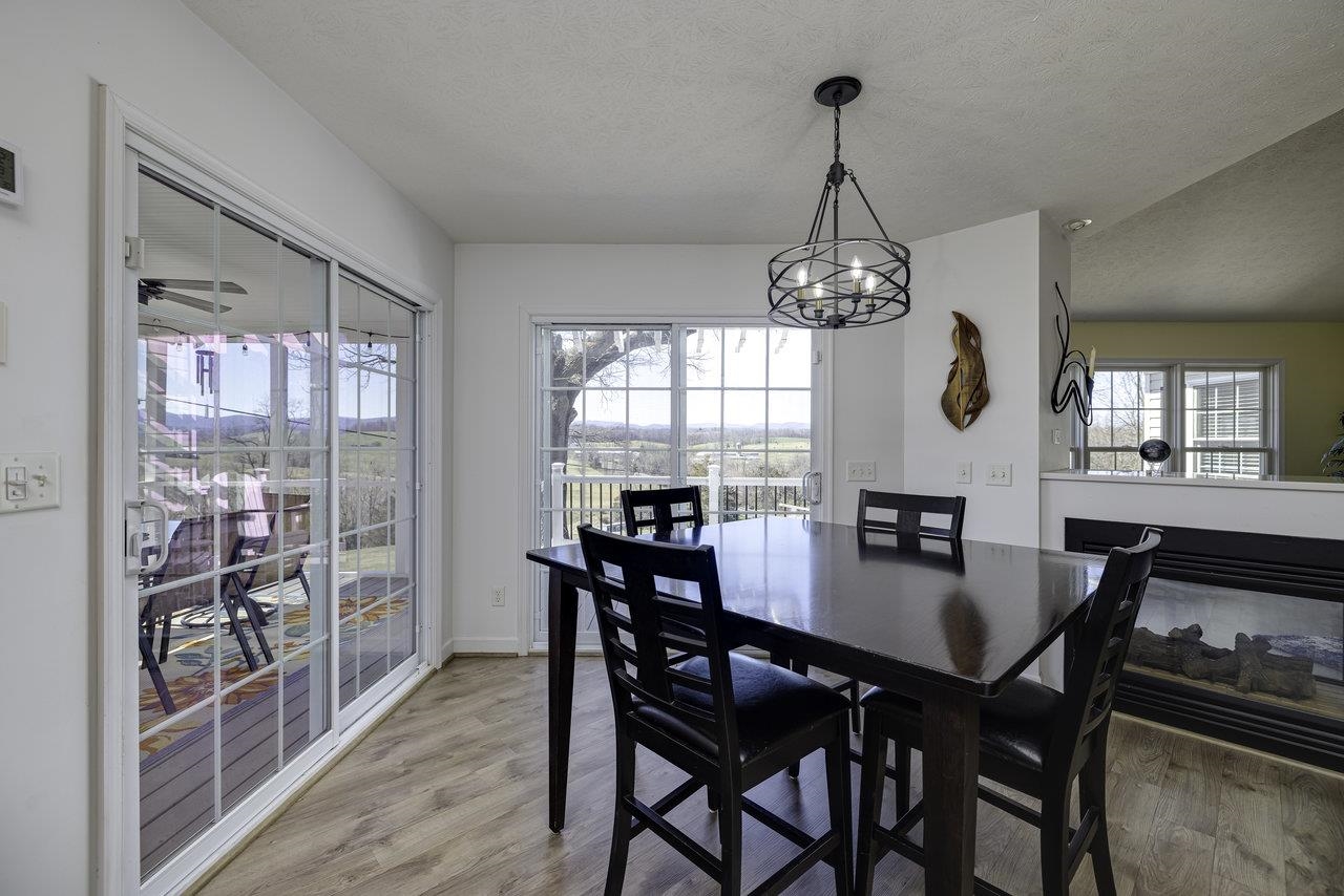1709 Mt Solon Road Mount Solon, VA 22843 - Photo 16 of 75 a view of a dining room with furniture window and wooden floor