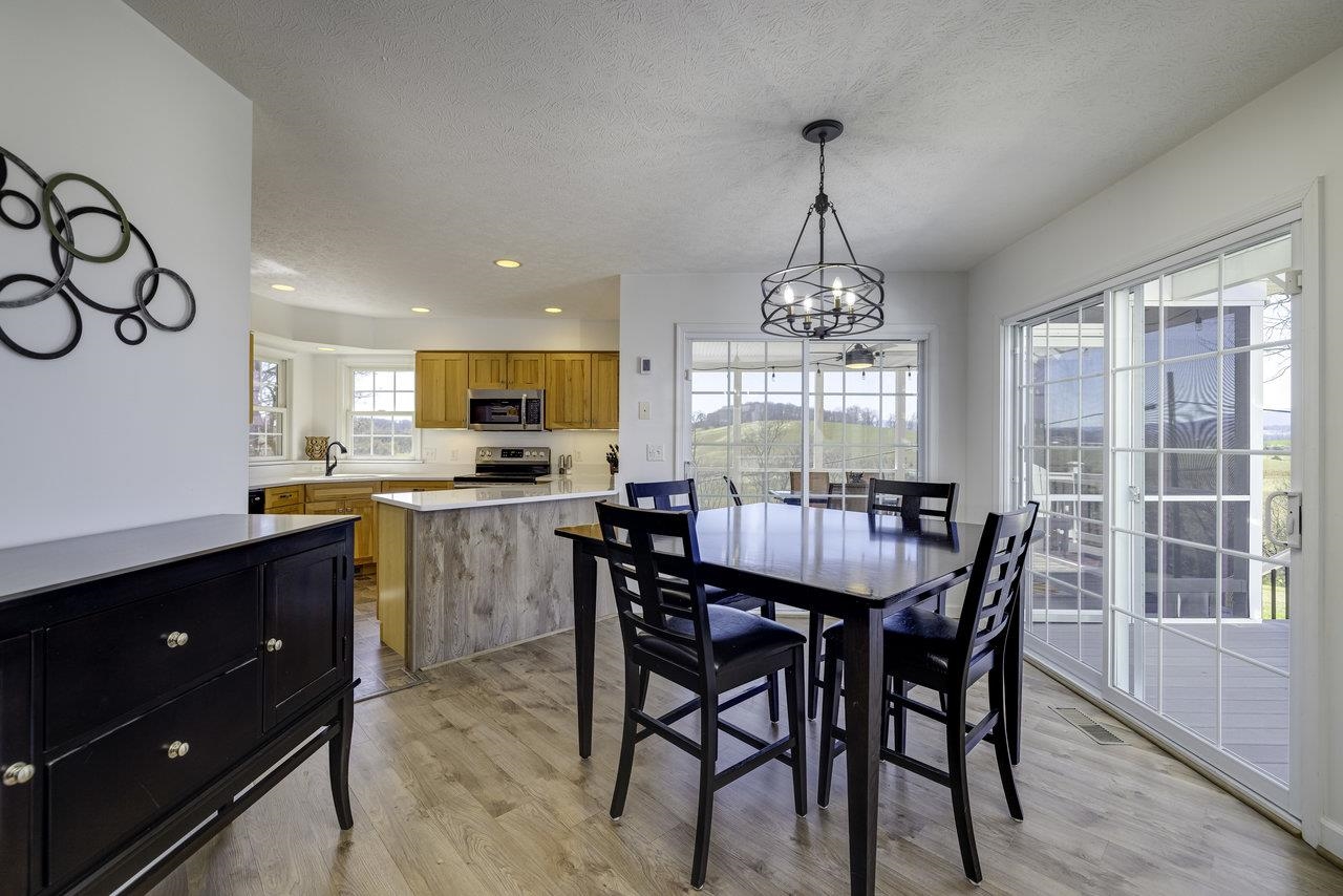 1709 Mt Solon Road Mount Solon, VA 22843 - Photo 17 of 75 a view of a dining room with furniture window and wooden floor