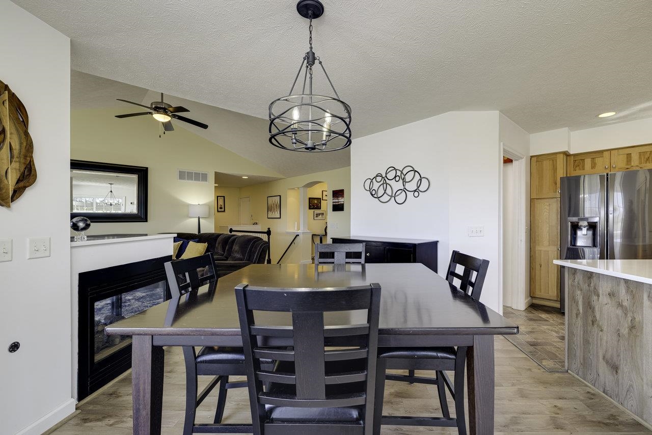 1709 Mt Solon Road Mount Solon, VA 22843 - Photo 18 of 75 a view of a dining room with furniture a chandelier and wooden floor