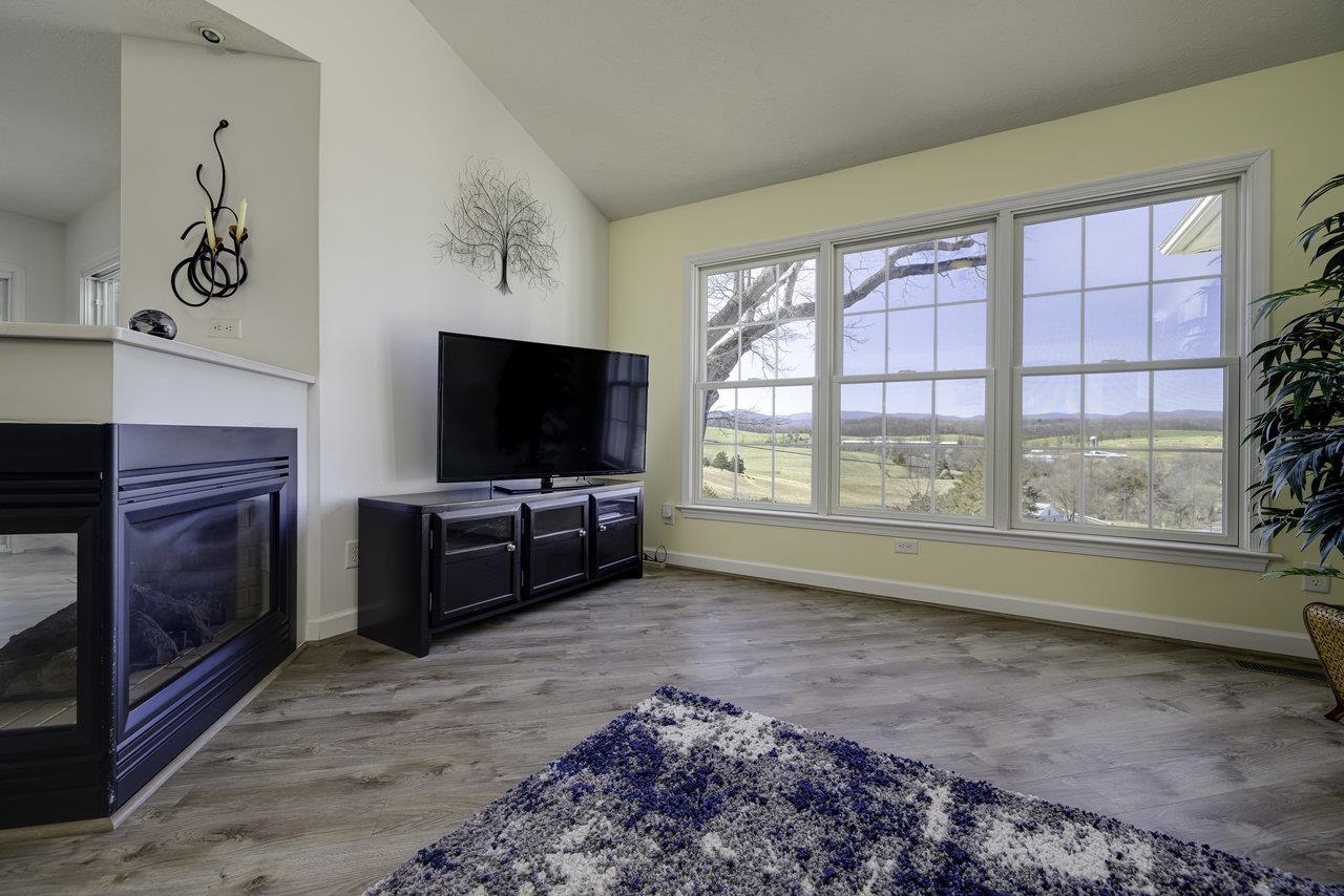 1709 Mt Solon Road Mount Solon, VA 22843 - Photo 19 of 75 a living room with a flat screen tv and a fireplace