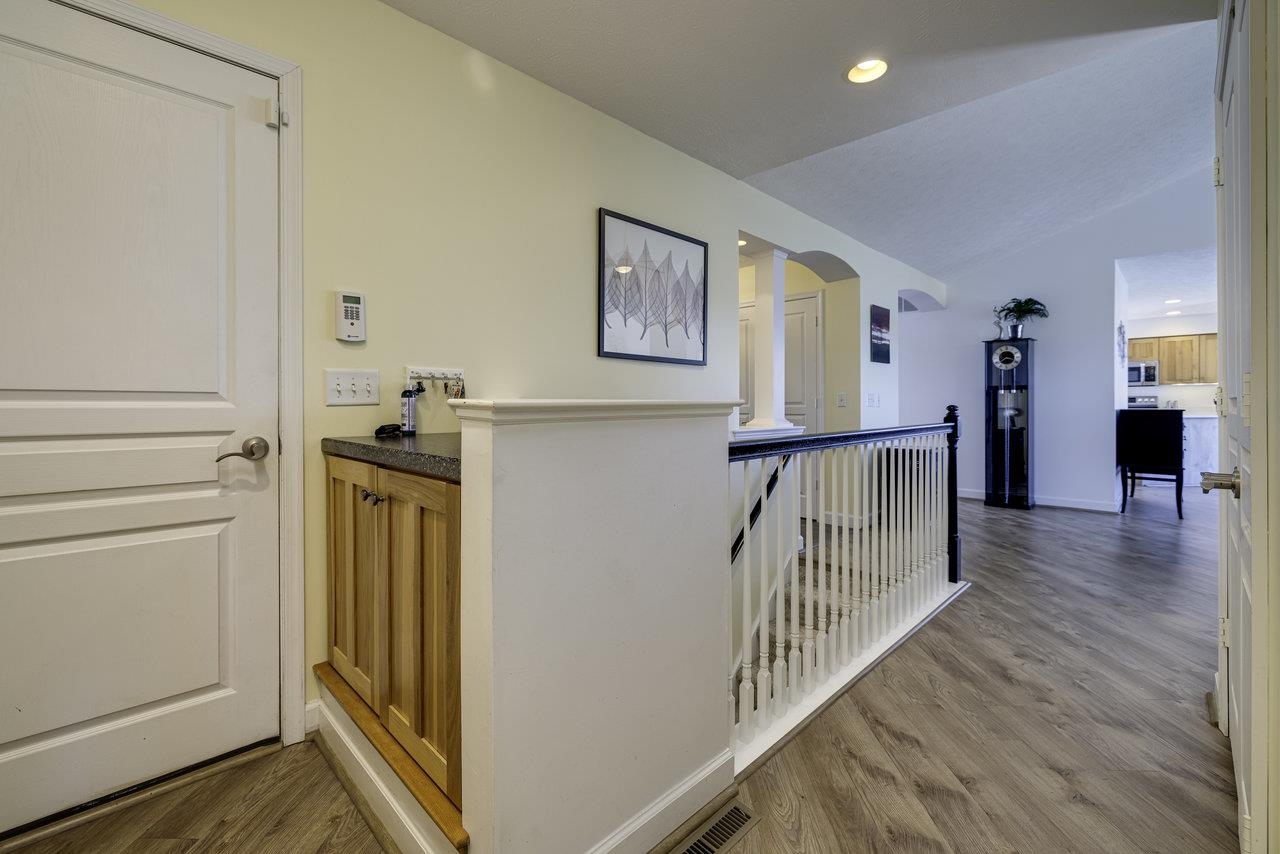 1709 Mt Solon Road Mount Solon, VA 22843 - Photo 25 of 75 a view of a hallway with wooden floor and stairs