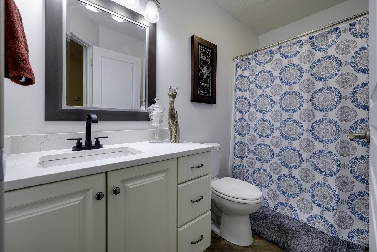 1709 Mt Solon Road Mount Solon, VA 22843 - Photo 33 of 75 a bathroom with a toilet sink and mirror
