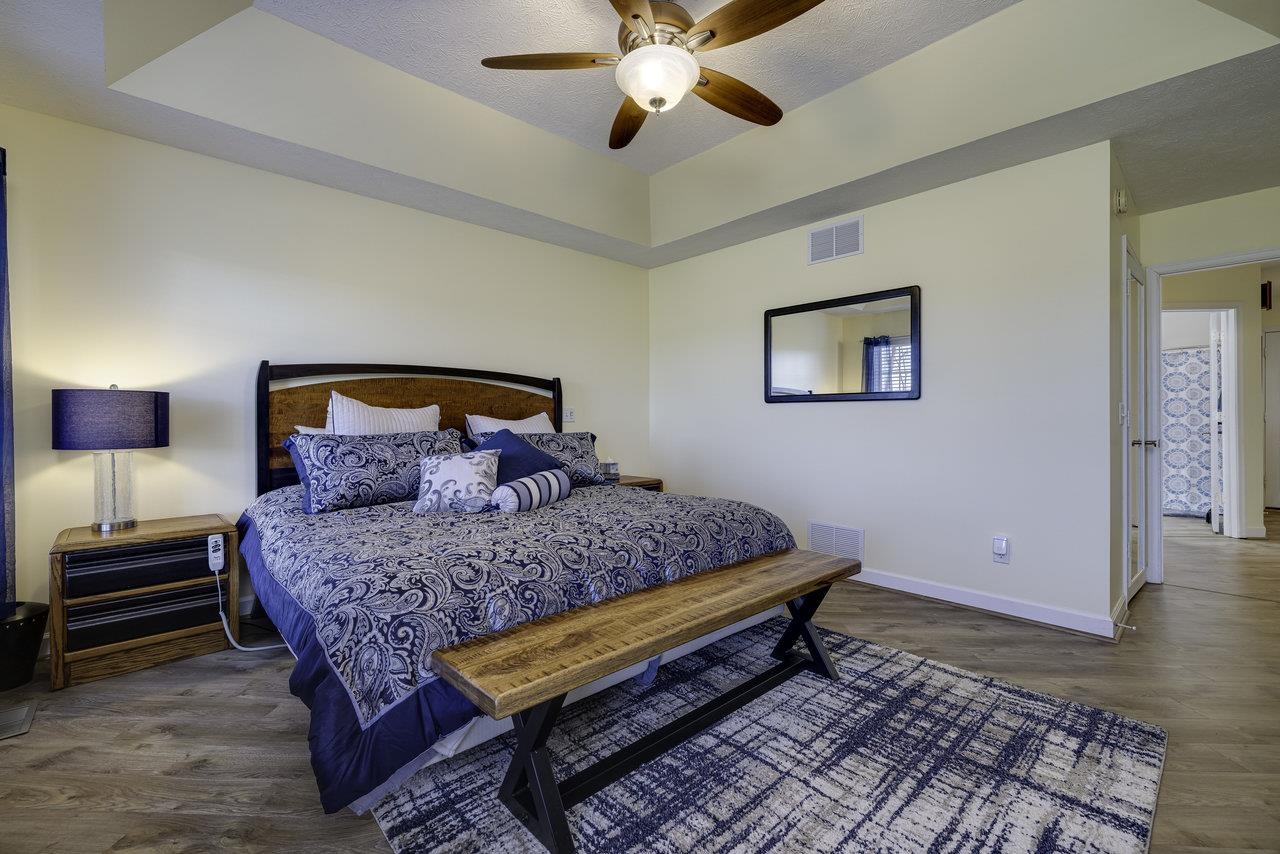 1709 Mt Solon Road Mount Solon, VA 22843 - Photo 4 of 75 a bedroom with a bed and wooden floor