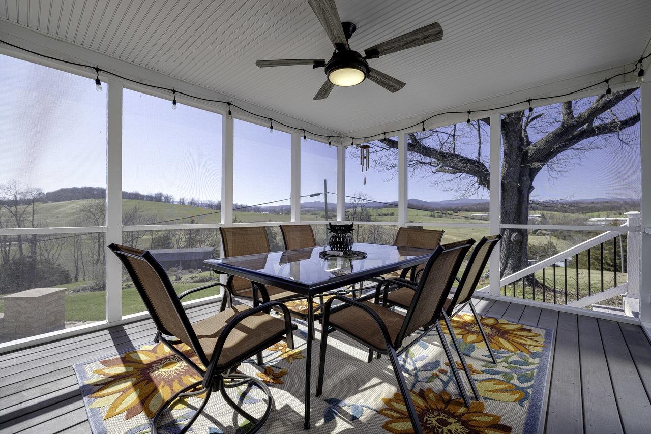 1709 Mt Solon Road Mount Solon, VA 22843 - Photo 43 of 75 a view of a dining room with furniture and a window