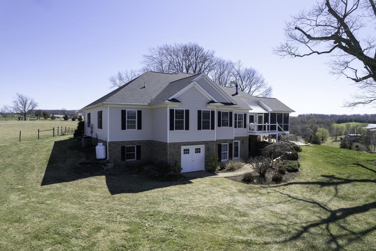 1709 Mt Solon Road Mount Solon, VA 22843 - Photo 46 of 75 a front view of a house with a yard outdoor seating and covered with trees