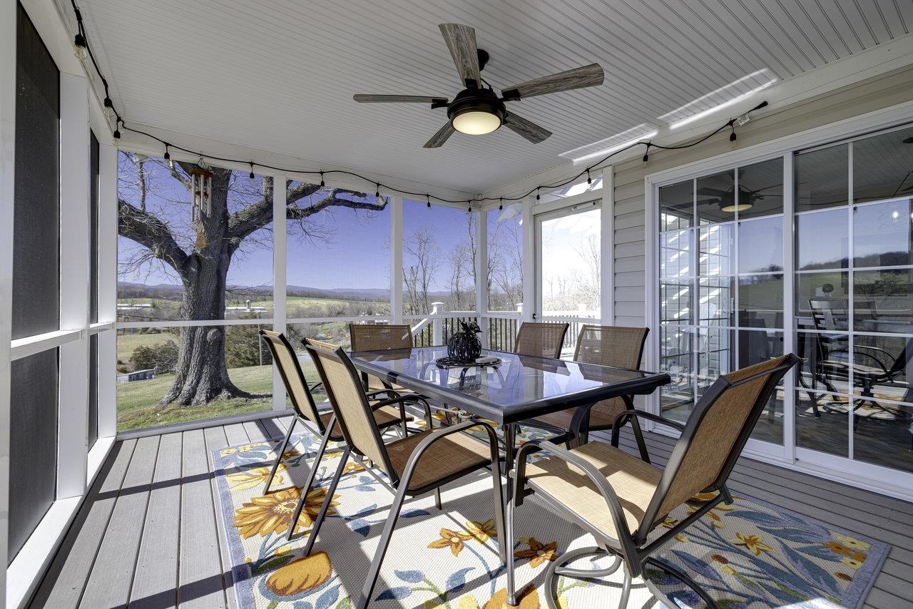 1709 Mt Solon Road Mount Solon, VA 22843 - Photo 5 of 75 a view of a dining room with furniture and wooden floor