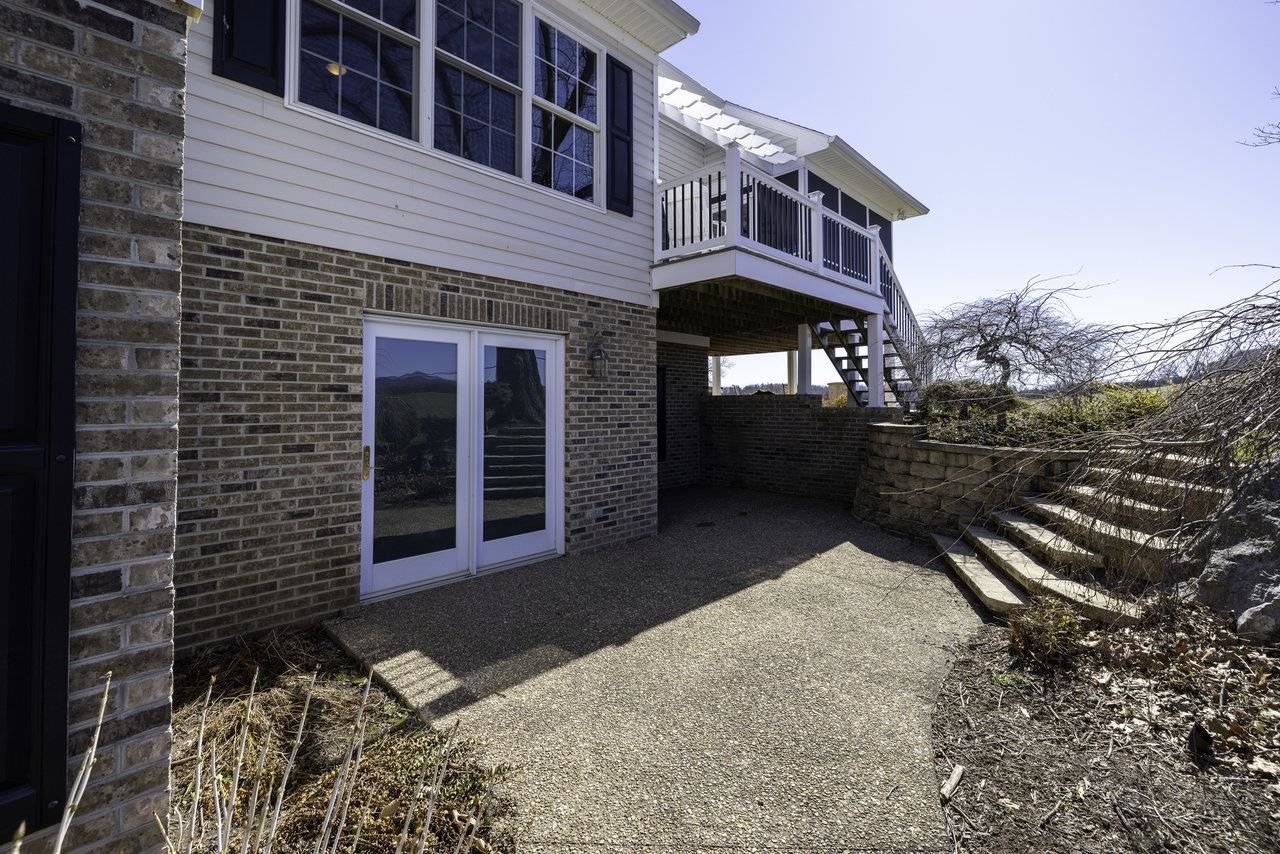 1709 Mt Solon Road Mount Solon, VA 22843 - Photo 54 of 75 a view of a brick house with a yard