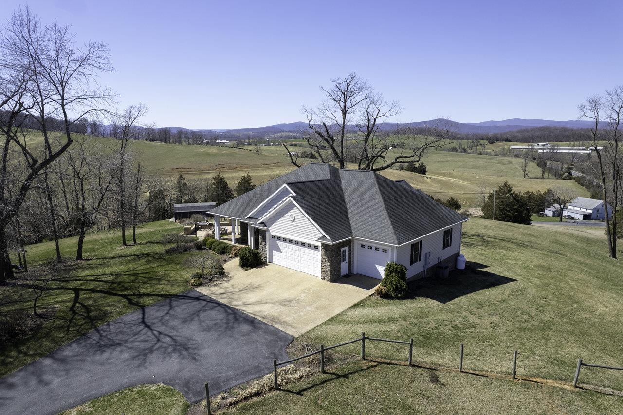 1709 Mt Solon Road Mount Solon, VA 22843 - Photo 60 of 75 a aerial view of a house with big yard and large trees