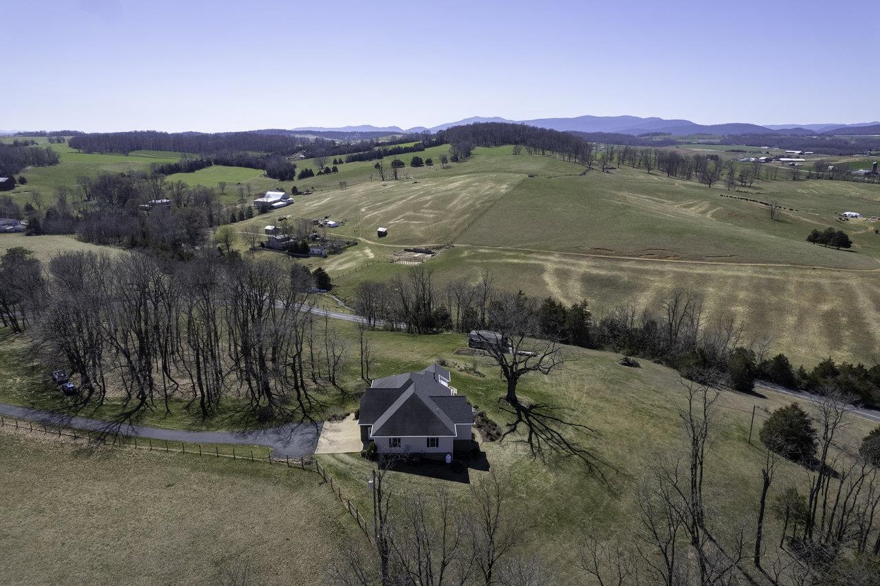 1709 Mt Solon Road Mount Solon, VA 22843 - Photo 66 of 75 a view of a lake with a mountain in the background