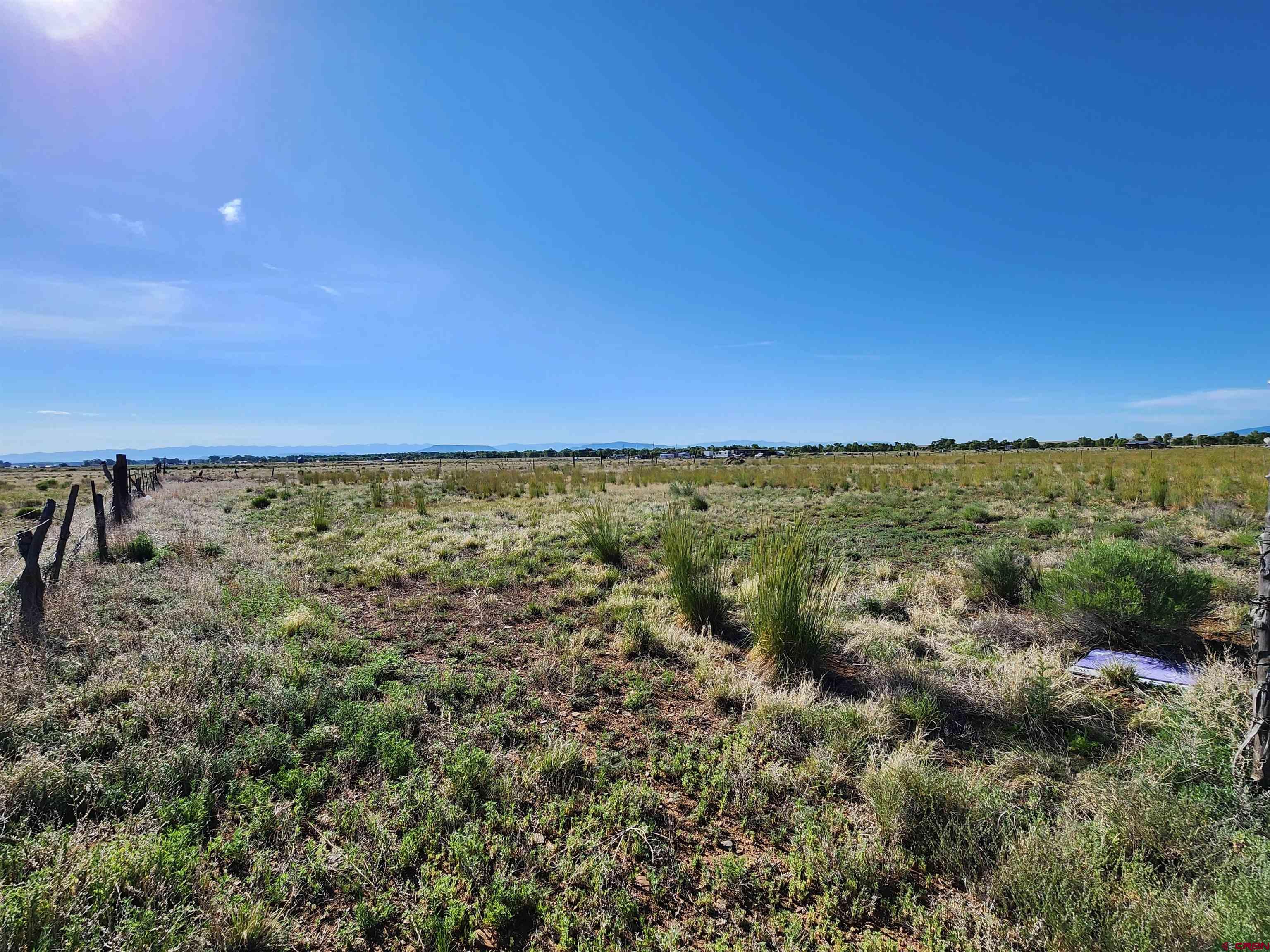 20596 County Road 8 Capulin, CO 81124 - Photo 2 of 8 a view of a field with an ocean