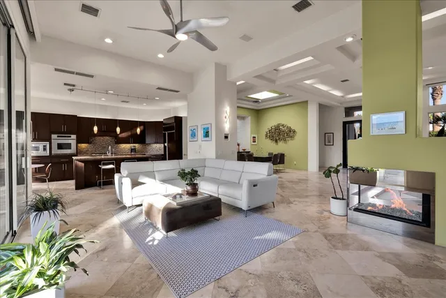 a large kitchen with a stove and a sink