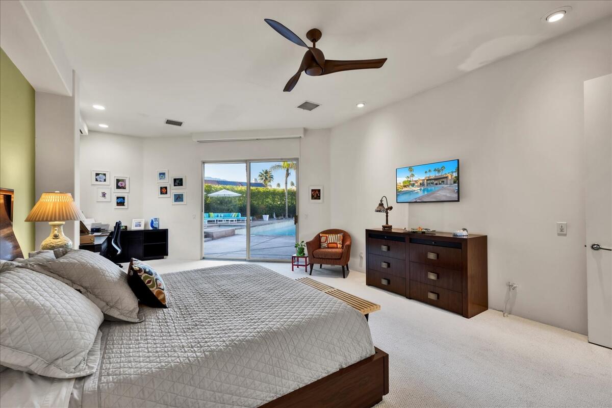 2 Silver Circle Rancho Mirage, CA 92270 - Photo 32 of 52 a bedroom with a bed and window