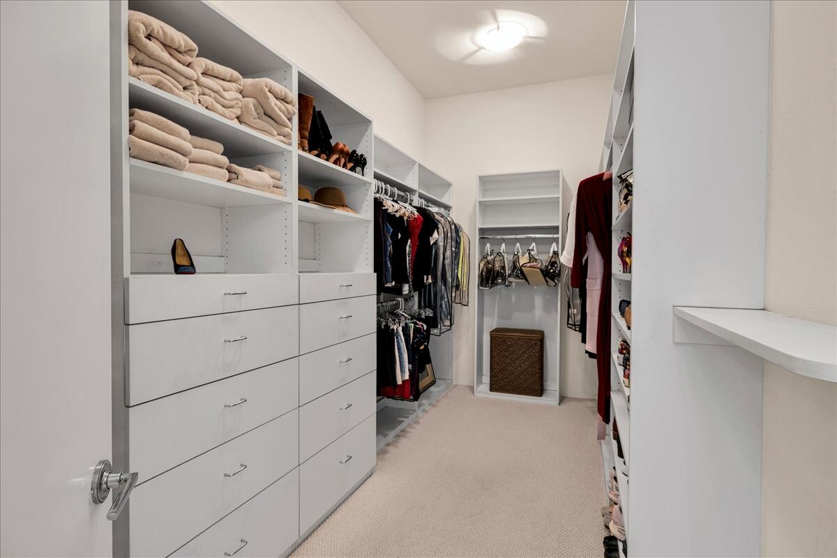 2 Silver Circle Rancho Mirage, CA 92270 - Photo 39 of 52 a view of walk in closet with clothes and shoes