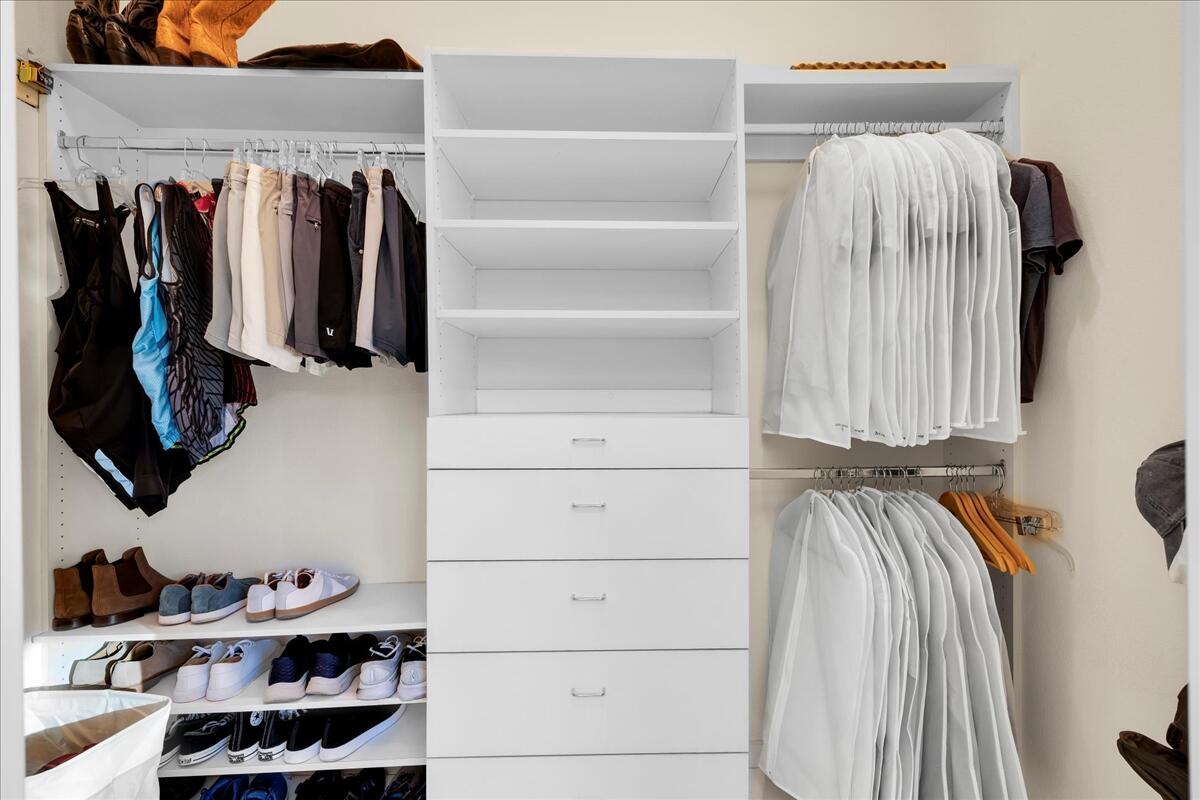 2 Silver Circle Rancho Mirage, CA 92270 - Photo 40 of 52 a view of walk in closet with clothes and shoes