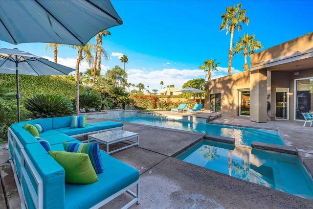 a bedroom with a bed and wall painting