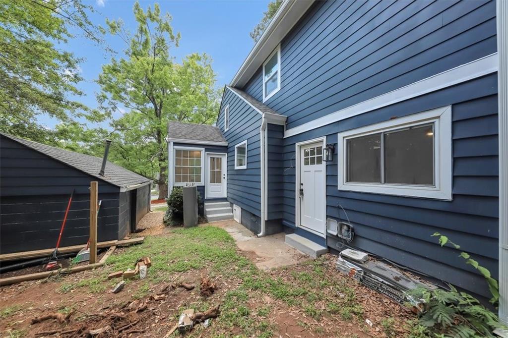 3423 Rugby Circle Atlanta, GA 30337 - Photo 4 of 44 a front view of a house with garden