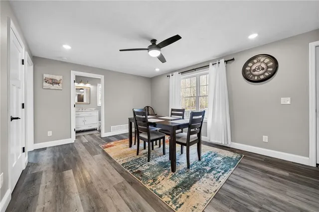 a view of a livingroom with furniture window and wooden floor