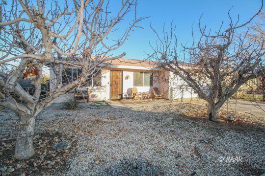 632 South Nevada Street Ridgecrest, CA 93555 - Photo 2 of 29 a front view of a house with a yard