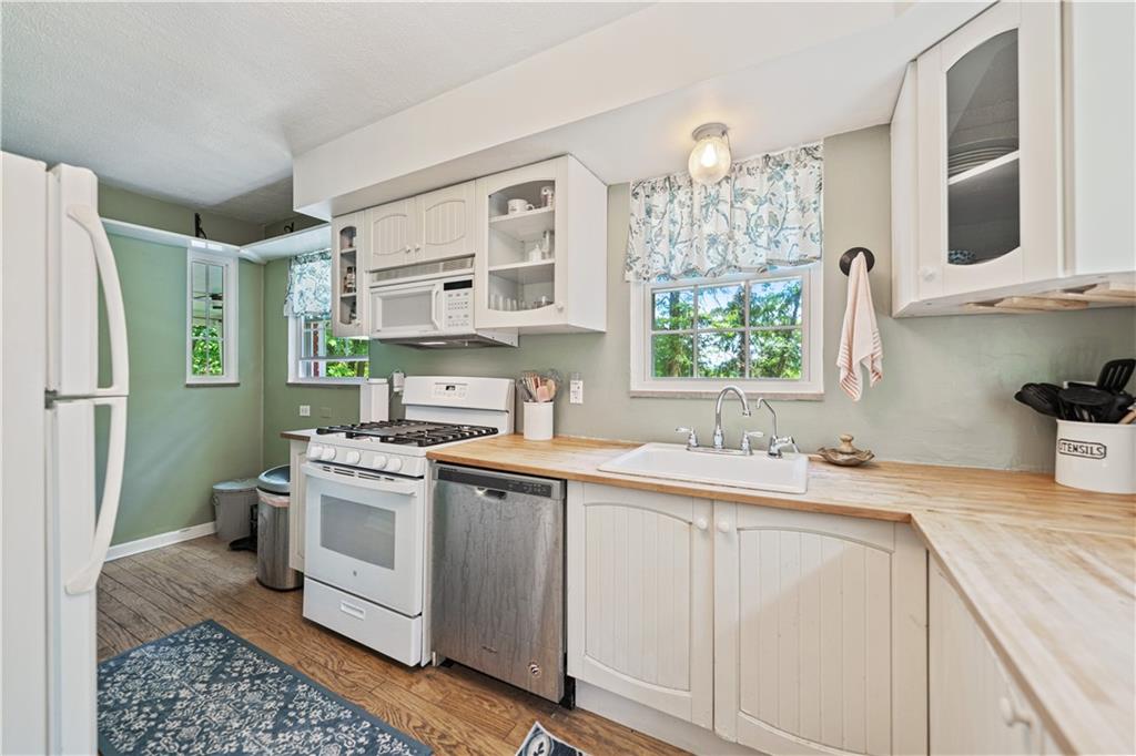 569 Kenilworth Drive Pittsburgh, PA 15228 - Photo 12 of 29 a kitchen with a sink cabinets and stainless steel appliances