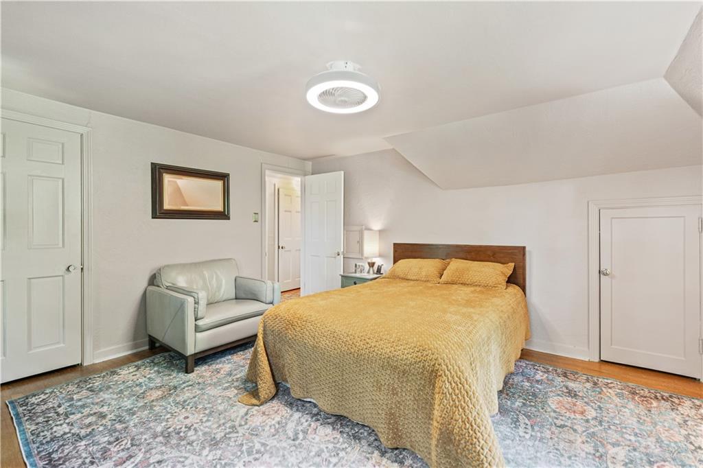 569 Kenilworth Drive Pittsburgh, PA 15228 - Photo 18 of 29 a bedroom with a bed and a couch