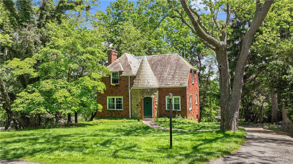 569 Kenilworth Drive Pittsburgh, PA 15228 - Photo 2 of 29 a view of a house with backyard porch and garden