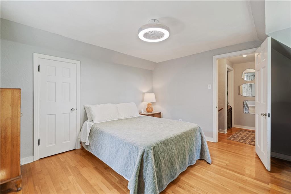 569 Kenilworth Drive Pittsburgh, PA 15228 - Photo 21 of 29 a bedroom with a bed and wooden floor