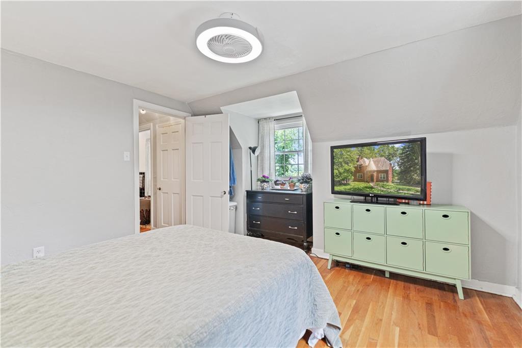 569 Kenilworth Drive Pittsburgh, PA 15228 - Photo 22 of 29 a bedroom with a bed and a flat screen tv