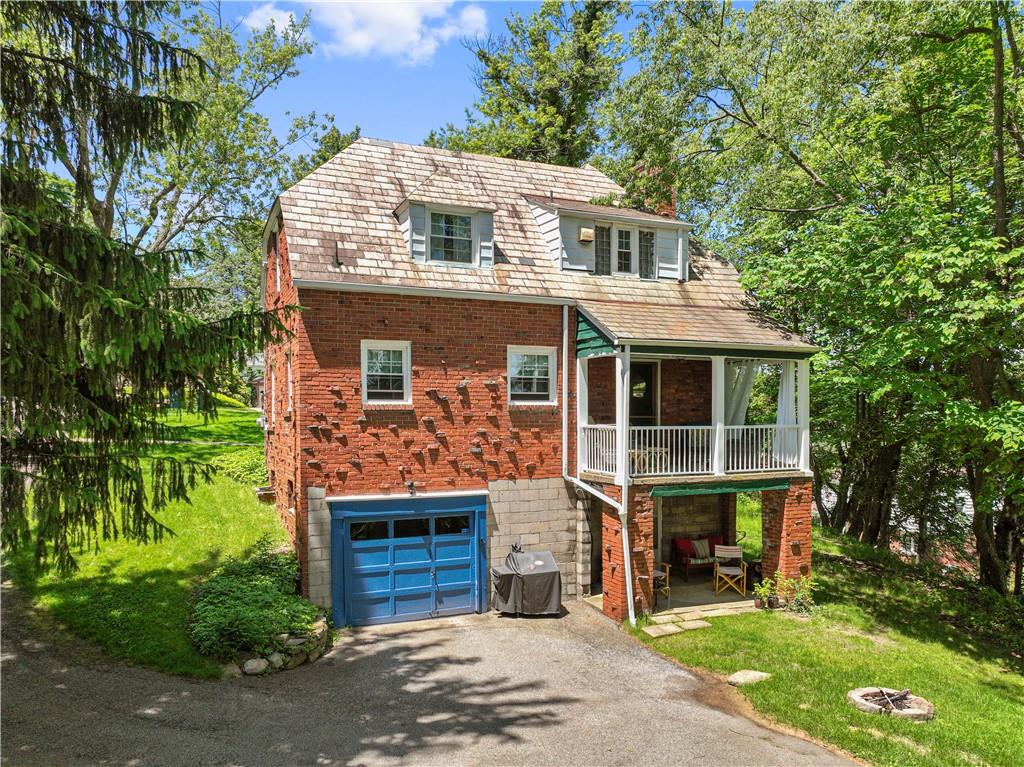 569 Kenilworth Drive Pittsburgh, PA 15228 - Photo 24 of 29 a front view of a house with a garden