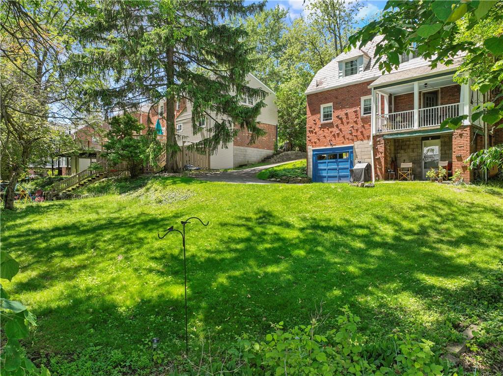569 Kenilworth Drive Pittsburgh, PA 15228 - Photo 25 of 29 a backyard of a house with yard and tree s