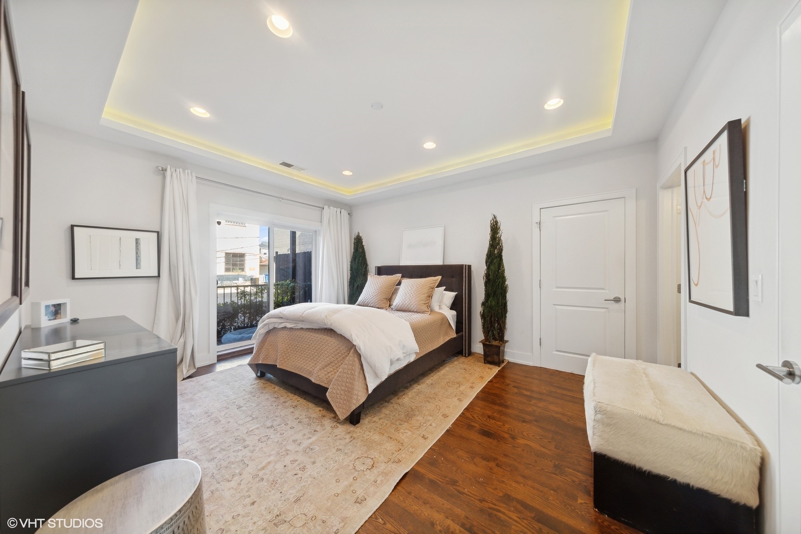 2548 West Irving Park Road, Unit 1E Chicago, IL 60618 - Photo 11 of 17 a spacious bedroom with a bed and a couch