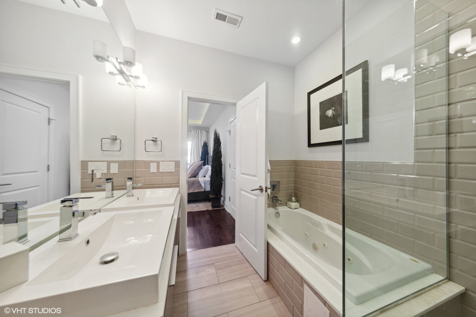 2548 West Irving Park Road, Unit 1E Chicago, IL 60618 - Photo 12 of 17 a bathroom with a bathtub shower sink and mirror
