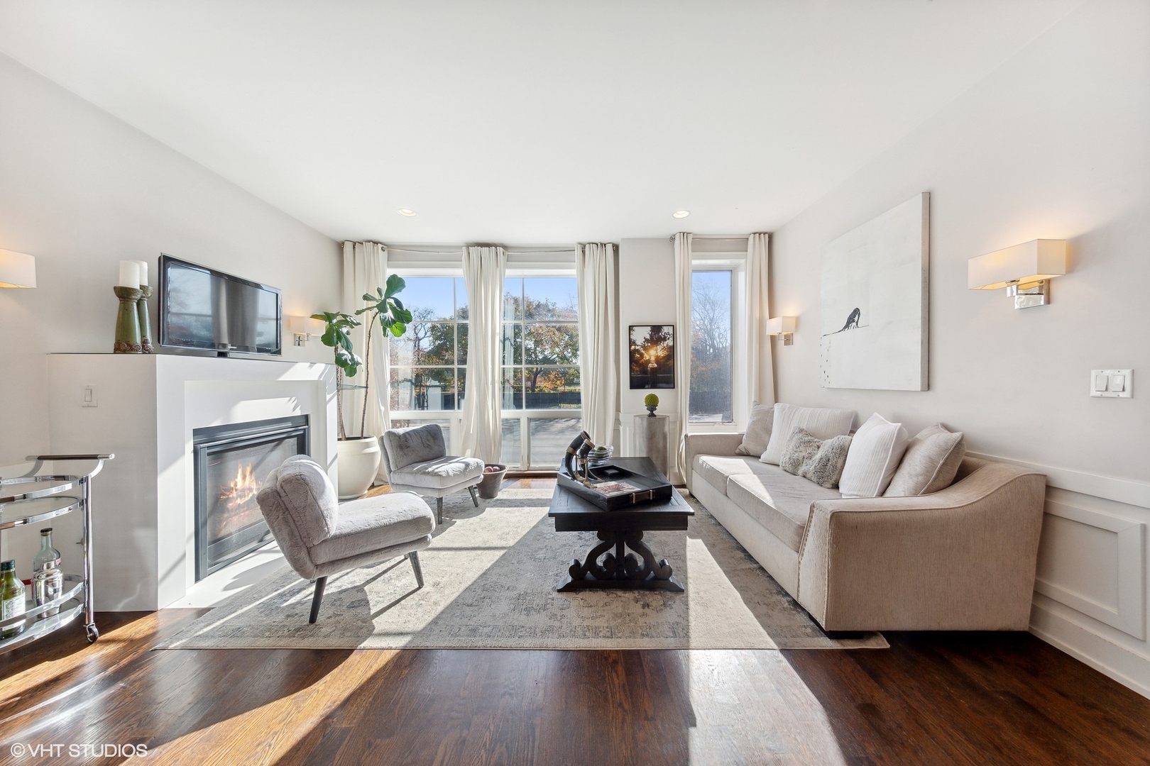 2548 West Irving Park Road, Unit 1E Chicago, IL 60618 - Photo 2 of 17 a living room with furniture and a fireplace