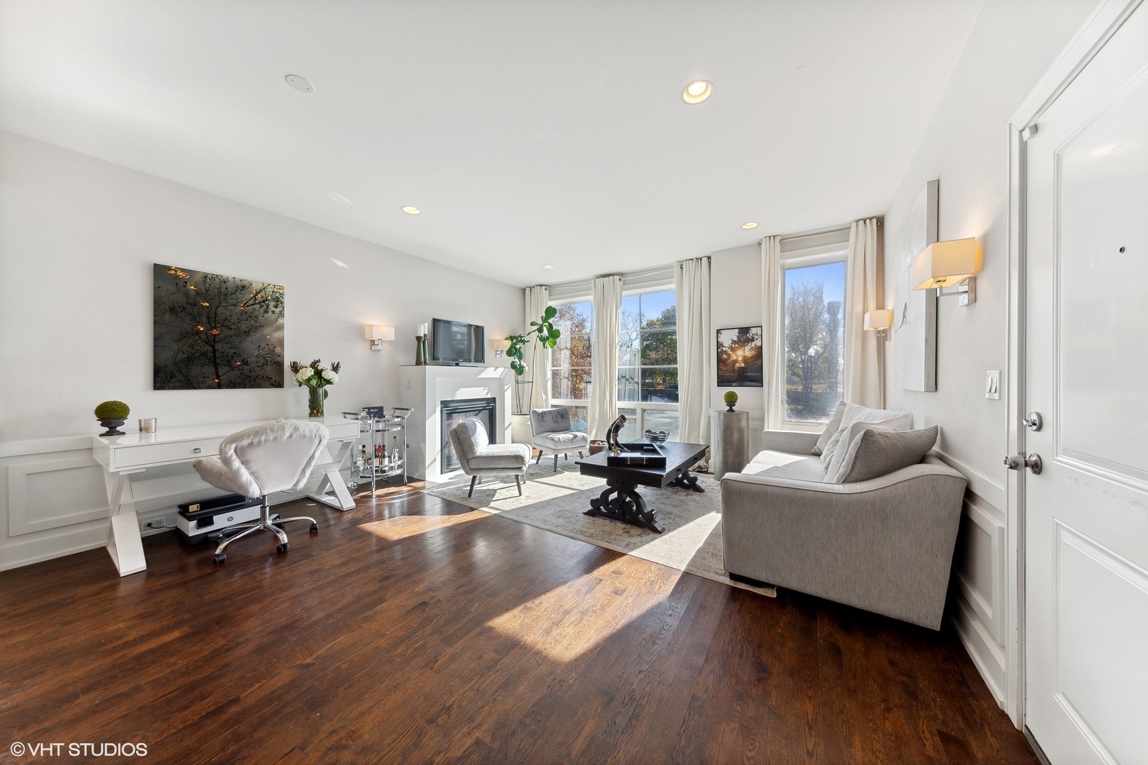 2548 West Irving Park Road, Unit 1E Chicago, IL 60618 - Photo 3 of 17 a living room with furniture window and wooden floor