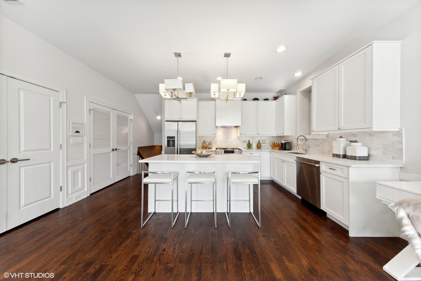 2548 West Irving Park Road, Unit 1E Chicago, IL 60618 - Photo 5 of 17 a kitchen with a white cabinets and counter space