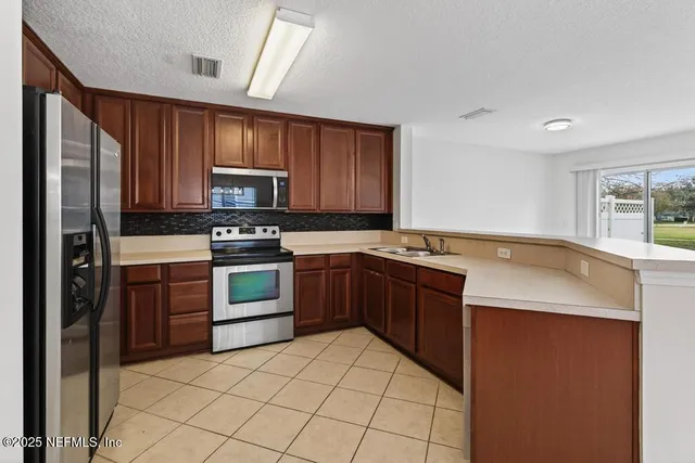 a view of an outdoor space and tennis court