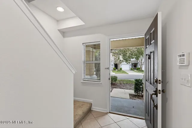 a view of kitchen with stainless steel appliances a refrigerator and a stove top oven