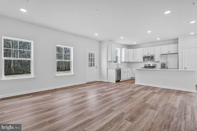 a view of kitchen with wooden floor and window
