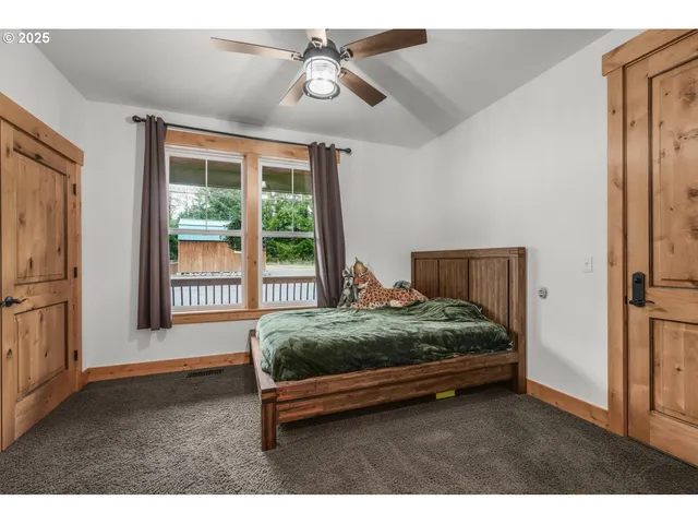 a bathroom with a sink stove and mirror