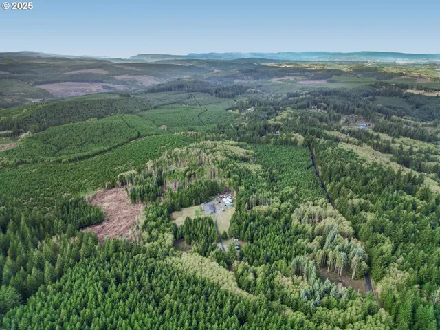 a view of a house with backyard porch and sitting area