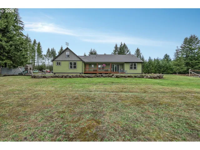 a bathroom with a granite countertop toilet sink and mirror