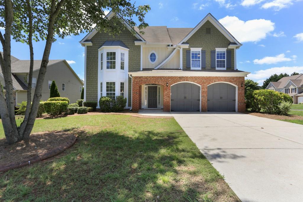 3380 East Gate Drive Cumming, GA 30041 - Photo 1 of 1 a front view of a house with a yard