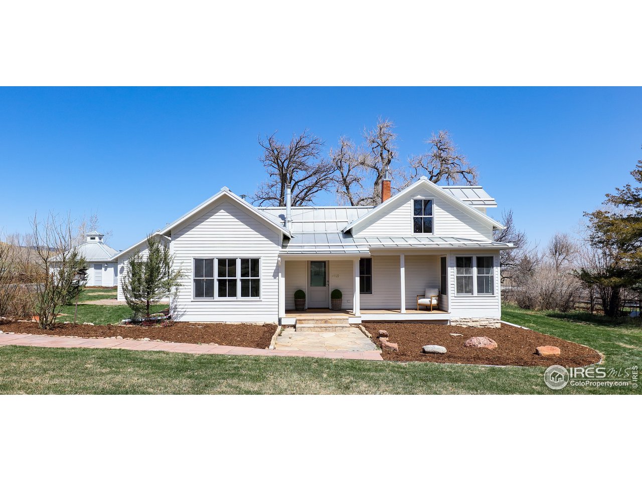 5629 Prospect Road Niwot, CO 80503 - Photo 1 of 40 a front view of a house with a yard