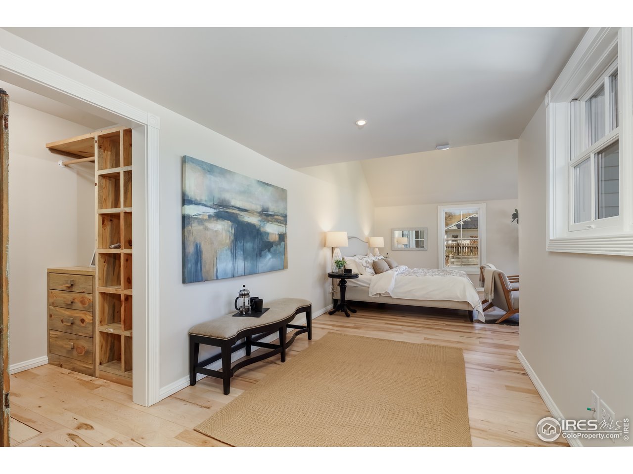 5629 Prospect Road Niwot, CO 80503 - Photo 12 of 40 a living room with furniture and a painting on the wall