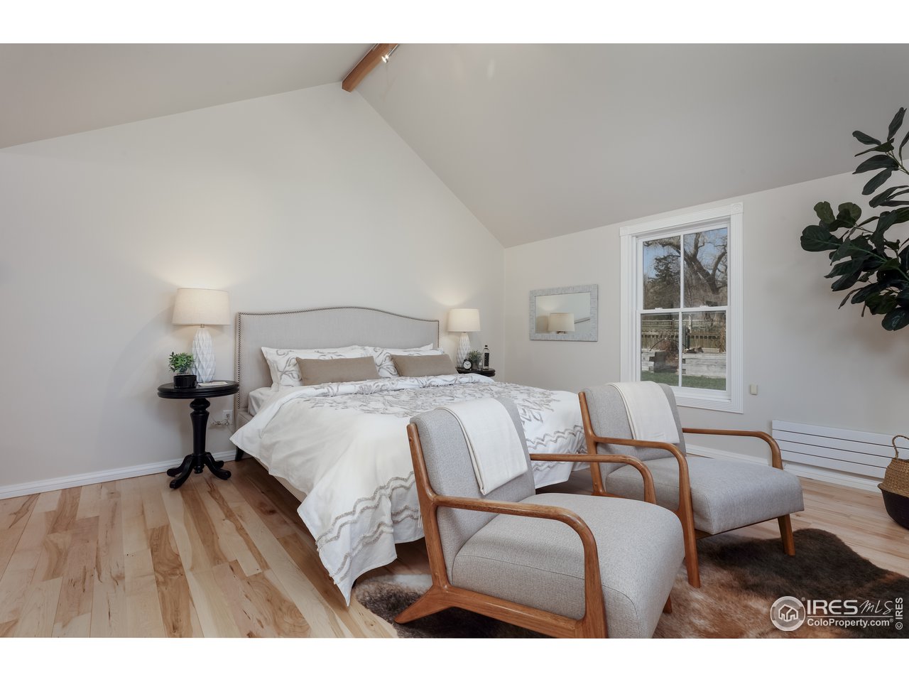 5629 Prospect Road Niwot, CO 80503 - Photo 14 of 40 a bedroom with a bed and window